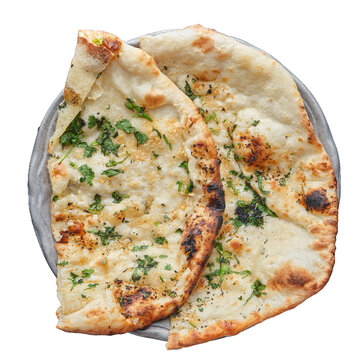 indian naan bread with garlic and butter shot from top down view and isolated
