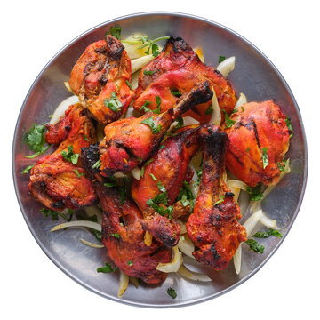 indian tandoori chicken on plate shot from top down view and isolated