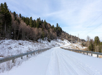 Winter road in the highlands, morning dawn, walking in the fresh air.