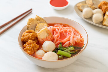 small flat rice noodles with fish balls and shrimp balls in pink soup, Yen Ta Four or Yen Ta Fo