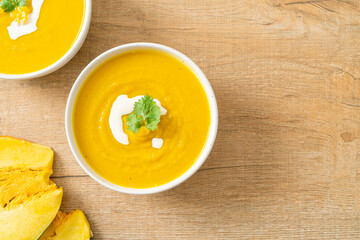 pumpkin soup in white bowl