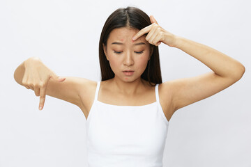 Asian woman facial skin problems, acne and inflammation, red rashes and allergies, chicken pox, sadness from rashes. Facial skin care concept for diseases and nerves