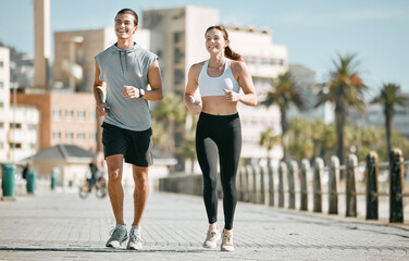 Couple, fitness and running together in the city for exercise, workout or cardio routine in Cape Town. Happy man and woman runner taking a walk or jog for healthy wellness or exercising outside