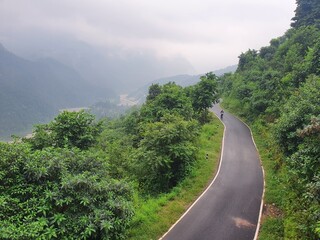 A man walking on street, lesser himalayas, dwara hills top ... pathway towards heaven 
