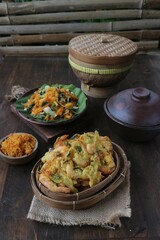 serving of fried shrimp flour and vegetable salad seasoned with grated coconut