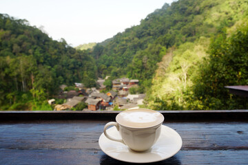 Hot Latte coffee with BAN MAE KAM PONG or MAE KAM PONG Village is little village in the valley hill...