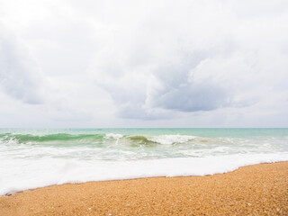 White Wave Sea Summer on Sand Beach with Blue Sky Background,Water Shore Beautiful for Tourism Relax Vacation Nature Tropical Travel in Holidays,Coast at Island with Cloud Sunlight.