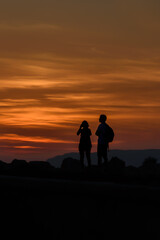 Fototapeta na wymiar Two tourists at sunset.