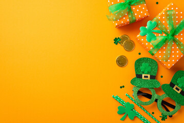 Fototapeta na wymiar St Patrick's Day concept. Top view photo of present boxes with green ribbon bows gold coins hat shaped glasses straws clovers and confetti on isolated orange background with copyspace