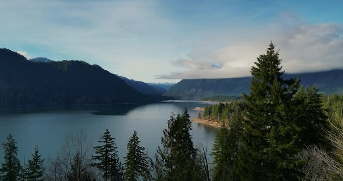 Fly out over Lake Cushman from the overlook. Beautiful forestand lake views with mountains