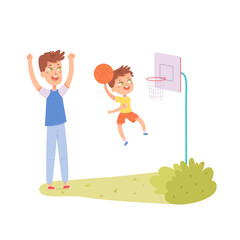 Father and son play basketball, cute kid jumping, boy holding ball to throw into basket