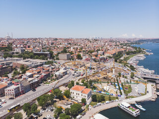 Fototapeta na wymiar Top view of the old city of Istanbul and the Bosphorus, in the foreground low-rise buildings, against the backdrop of city hills, on a warm summer day