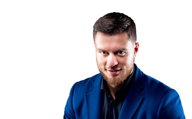 Attractive young guy posing in studio. Portrait of a handsome man with light beard and nice face. Confident look to the camera. Horizontal portrait