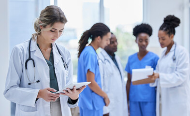 Doctor, healthcare and woman with tablet, team and update results for procedure, charts and focus. Medical professional, staff and female employee with device, telehealth and online reading for cure