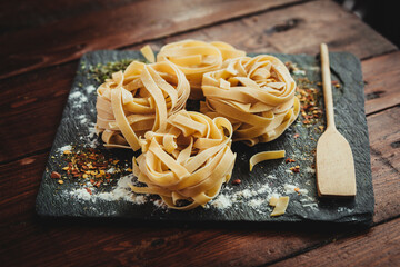 Delicious fresh Italian pasta, fettuccini with spices.