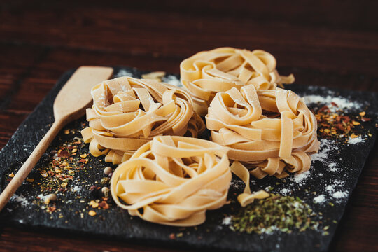 Delicious fresh Italian pasta, fettuccini with spices.