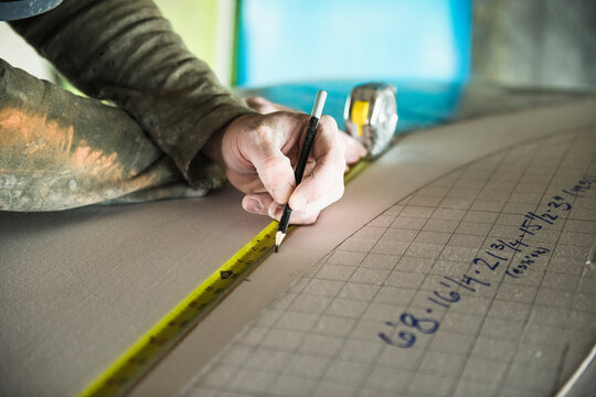 Surfboard Shaper measuring a new design