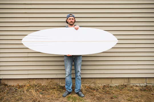 Surfboard Shaper refining a new design - Powered by Adobe