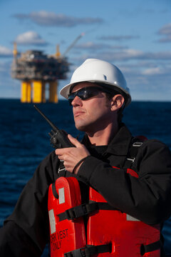 Offshore energy production with person on ship