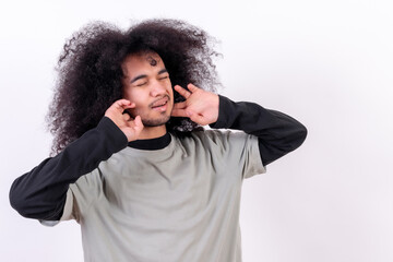 Suffering from neck pain. Young boy with afro hair on white background