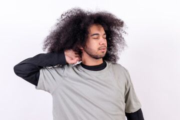 Suffering from cervical pain. Young boy with afro hair on white background
