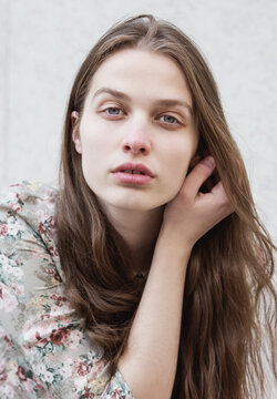 Portrait of young beautiful woman without makeup