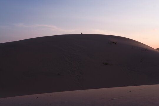 Sand dunes at sunset with no person