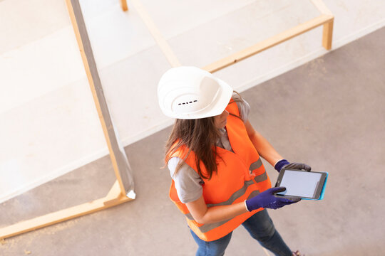 Young woman working in a workshop as artisan manual worker