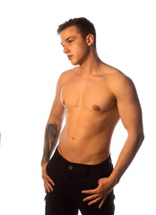 Fototapeta premium Handsome muscular shirtless young man standing confident