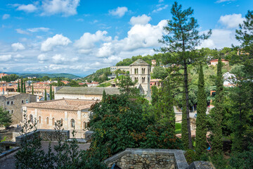 View of the tower and the monastery of St. Peter Galligans in the historic part of the city (Girona, Spain)