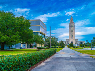 Louisiana State Capitol and the sidewalks with modern buildings, and manicured garden in Downtown...