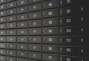 Mailboxes for letters and correspondence. Modern mailboxes with numbers in the lobby of a residential or office building close-up.