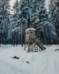 Hunters observatory deep in a snowy forest