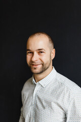 portrait of a thirty-year-old businessman in jeans and a shirt