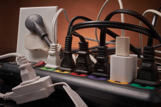 Electrical outlets and power strip overloaded beyond capacity