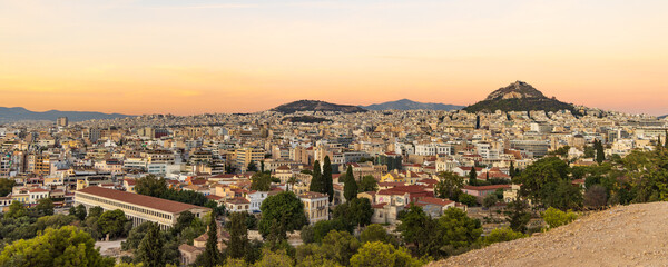 Fototapeta na wymiar View from the hill of the Acropolis site on a sunny evening during sunset in Athens Greece