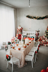 Christmas decorated table with cake and cookies