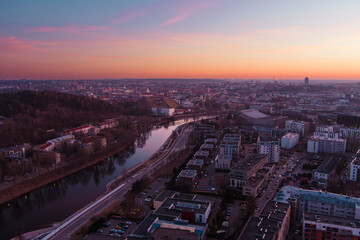 Fototapeta na wymiar Scenic aerial view of Vilnius Old Town and Neris river at nightfall. Sunset landscape.