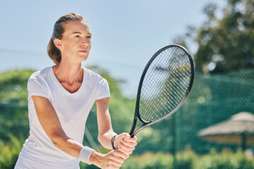 Senior woman, tennis player and ready in sports game for ball, match or hobby on the court. Happy...