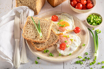Homemade and healthy breakfast with bread and fried eggs.