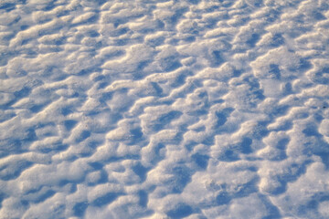 Texture of snow drifts close-up. Snow drifts, which appeared after snowfalls in the winter season.