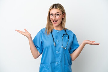 Young surgeon doctor woman isolated on white background with shocked facial expression