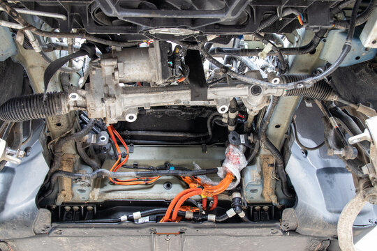 Vinnytsia, Ukraine - 20 Feb 2021: Bottom view of a disassembled Tesla Model 3, with subframe and electric motor removed, for repair.