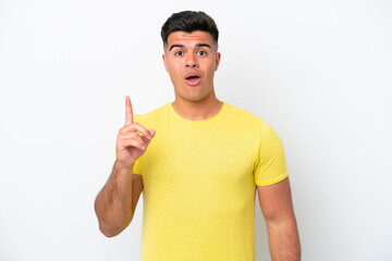 Young caucasian handsome man isolated on white background intending to realizes the solution while lifting a finger up