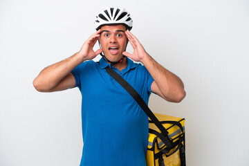 Young caucasian man with thermal backpack isolated on white background with surprise expression