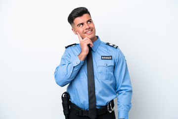 Young police caucasian man isolated on white background thinking an idea while looking up