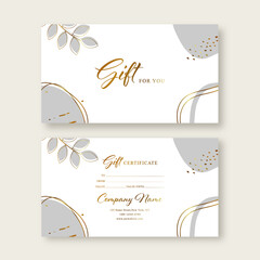 Gift voucher card template. Modern discount coupon or certificate layout with abstract golden art backgrounds and botanical palm leaves Vector illustration.