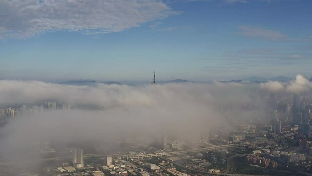 High angle view of Kuala Lumpur city during low cloud