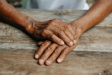 Male wrinkled hands, old man is wearing