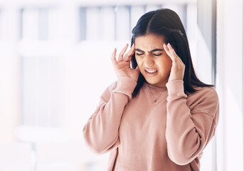 Headache, stress or mockup with an indian woman on a blurred background suffering from pain or anxiety. Compliance, mental health or burnout and a frustrated young female struggling with a migraine - Powered by Adobe